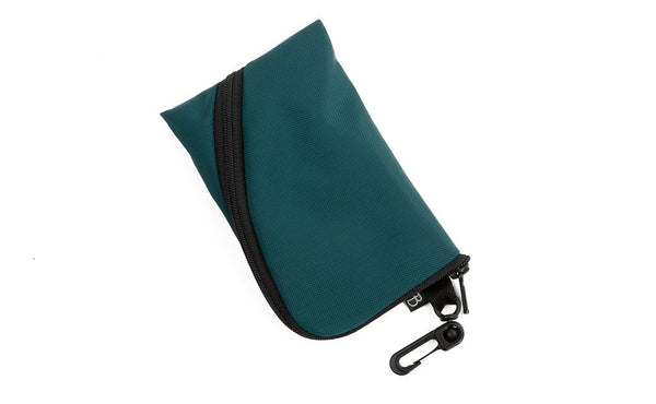 A Mini Ghost Whale Pouch in Seapine Green (dark green).